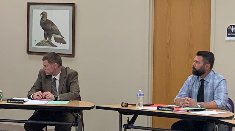 Bellbrook Superintendent Doug Cozad (left) and School Board President Mike Kinsey (right). The Board approved a list of teachers authorized to use firearms in the event of an active shooter Thursday. LONDON BISHOP/STAFF