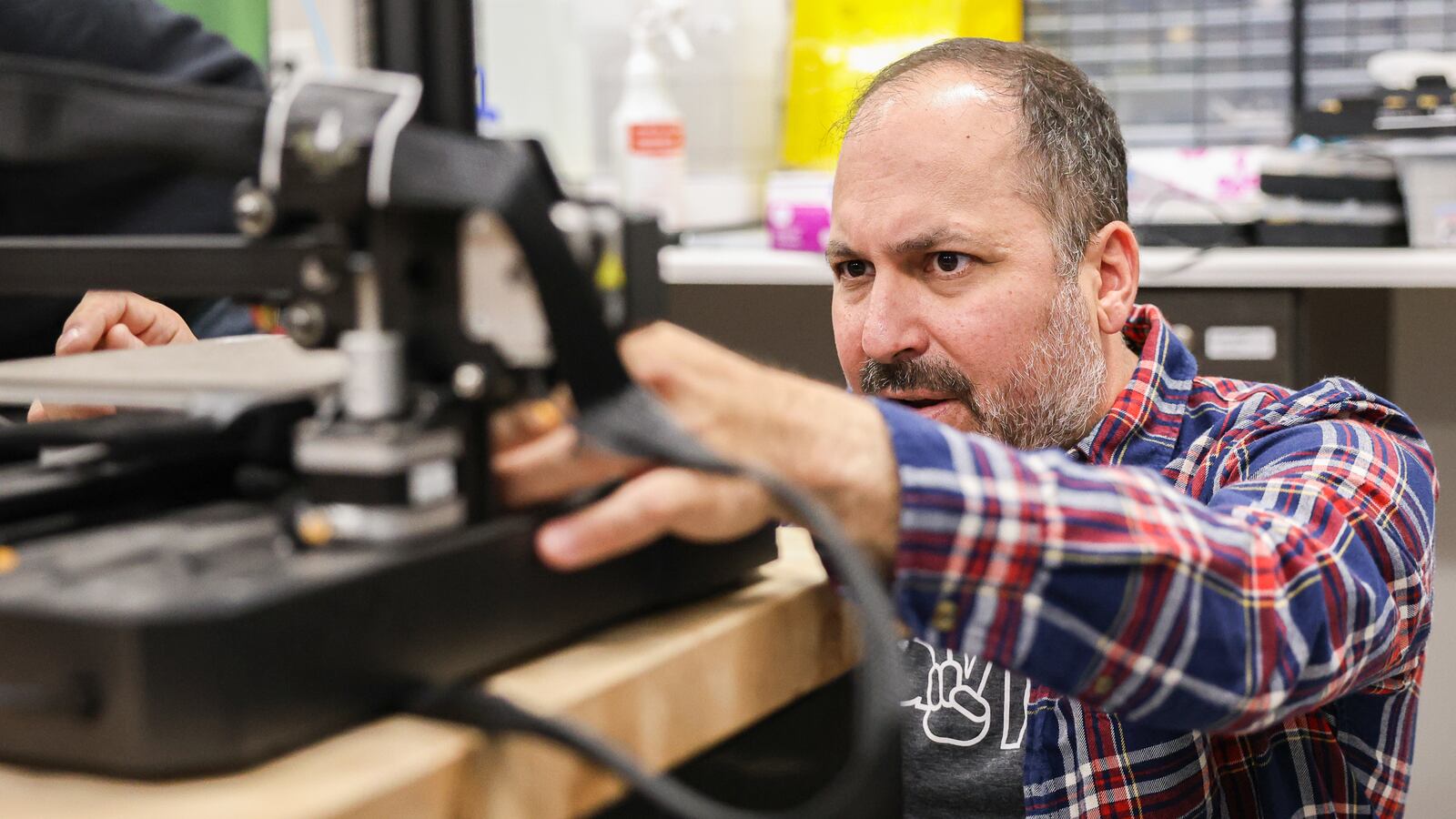 Doug Picard has been named a Dayton Daily News Community Gem for his work at Greene County Career Center, where he is an instructor. His class is working on a project retrofitting kid cars for hospitalized children. BRYANT BILLING / STAFF
