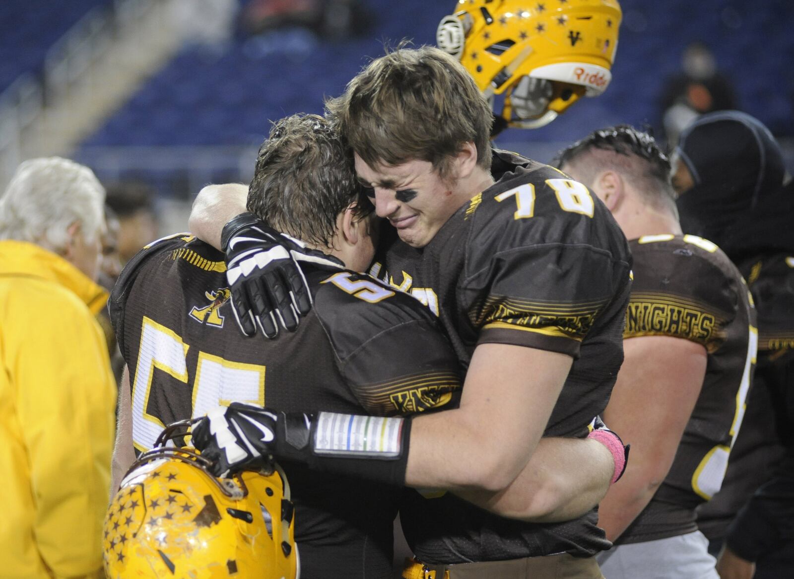Cameran Ryan (78) and and Jack Miller are overcome after Alter’s 42-6 loss to Chagrin Falls Kenston in a D-III high school football state championship at Canton’s Tom Benson Hall of Fame Stadium on Friday, Nov. 30, 2018. MARC PENDLETON / STAFF