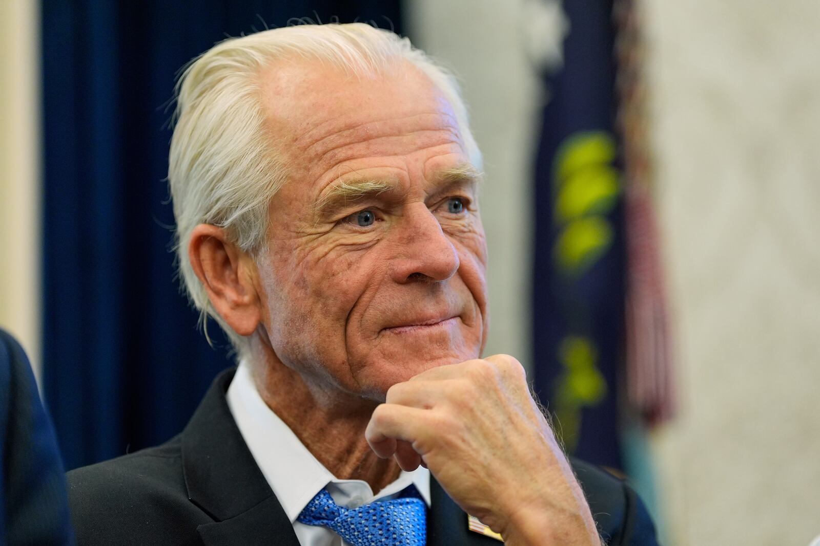 White House trade adviser Peter Navarro listens as President Donald Trump speaks as he signs executive orders in the Oval Office of the White House, Thursday, April 17, 2025, in Washington. (AP Photo/Alex Brandon)