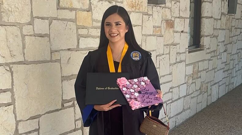 In this undated photo provided by her attorney, Todd Pomerleau, Any Lucia Lopez Belloza celebrates her high school graduation in Texas. (Any Lucia Lopez Belloza's attorney via AP)