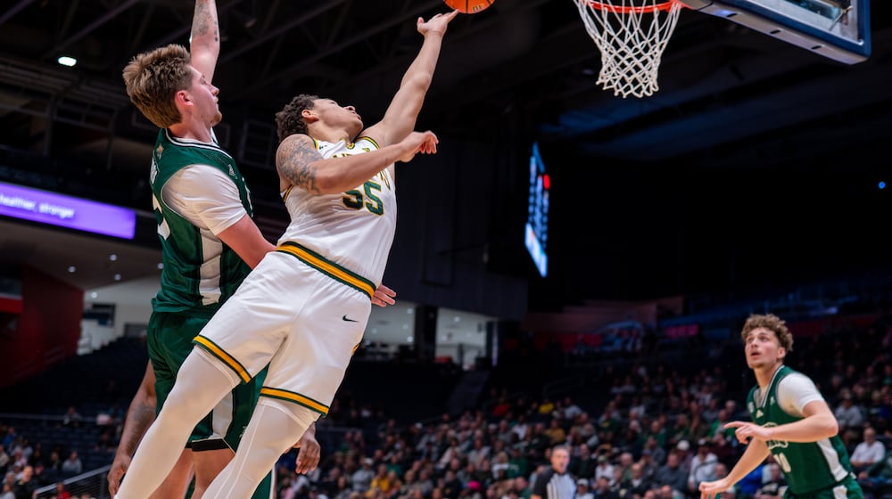 Wright State University's Michael Cooper shoots the ball during their game against Ohio University on Oct. 20 at UD Arena. NICK PHILLIPS / CONTRIBUTED PHOTO