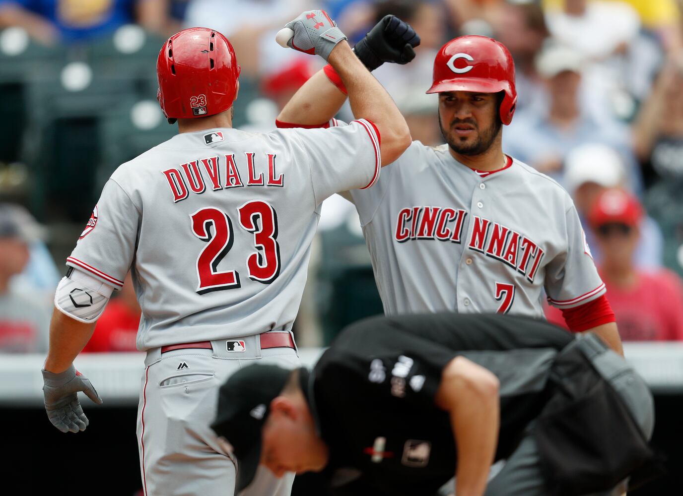 PHOTOS: Reds pile up 13 hits, beat the Rockies