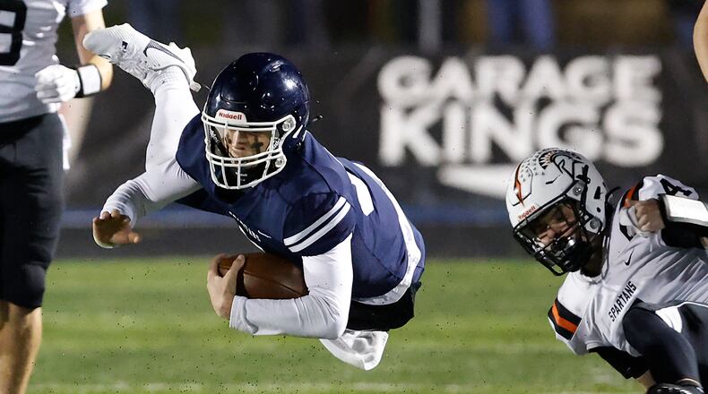 Valley View's Caden Henson hangs in the air after being tripped up by Waynesville's Connor Berrey during their playoff game at Spingboro Friday, Nov. 17, 2023. BILL LACKEY/STAFF
