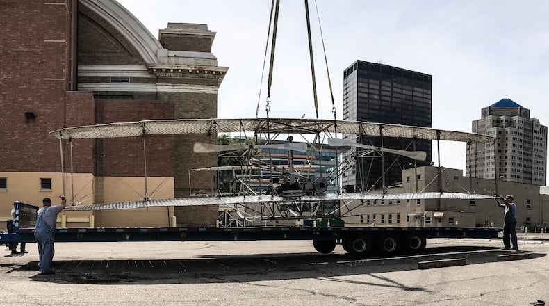 Workers for Schumacher Crane moved Friday August 21, 2020 the Wright Brothers lll sculpture that has been on Monument Ave. across from Riverscape Metro Park for 19 years. The sculpture will be moved to the west end of the Third St. bridge. The property will be redeveloped for a six story apartment building.