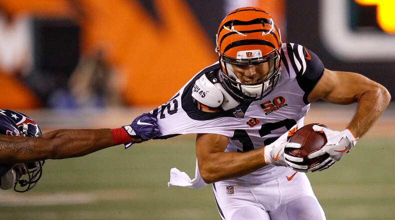 CINCINNATI, OH - SEPTEMBER 14: Alex Erickson #12 of the Cincinnati Bengals attempts to break a tackle against the Houston Texans during the second half at Paul Brown Stadium on September 14, 2017 in Cincinnati, Ohio. (Photo by Joe Robbins/Getty Images)