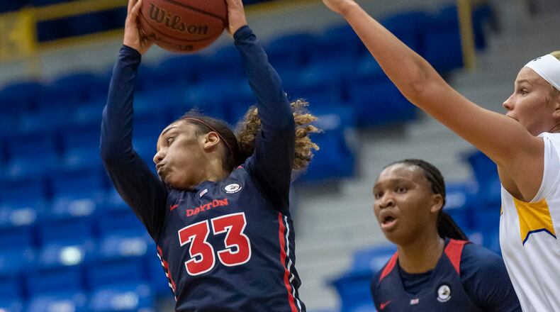 Dayton's Destiny Bohanon grabs a rebound against Morehead State on Nov. 25, 2020, in Morehead, Ky. Photo by John Flavell
