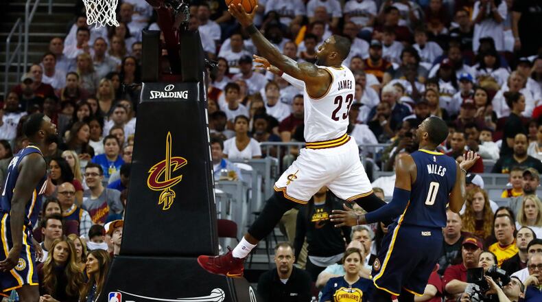 CLEVELAND, OH - APRIL 15: LeBron James #23 of the Cleveland Cavaliers gets to the basket past CJ Miles #0 of the Indiana Pacers during the first half in Game One of the Eastern Conference Quarterfinals during the 2017 NBA Playoffs at Quicken Loans Arena on April 15, 2017 in Cleveland, Ohio. NOTE TO USER: User expressly acknowledges and agrees that, by downloading and or using this photograph, User is consenting to the terms and conditions of the Getty Images License Agreement. (Photo by Gregory Shamus/Getty Images)