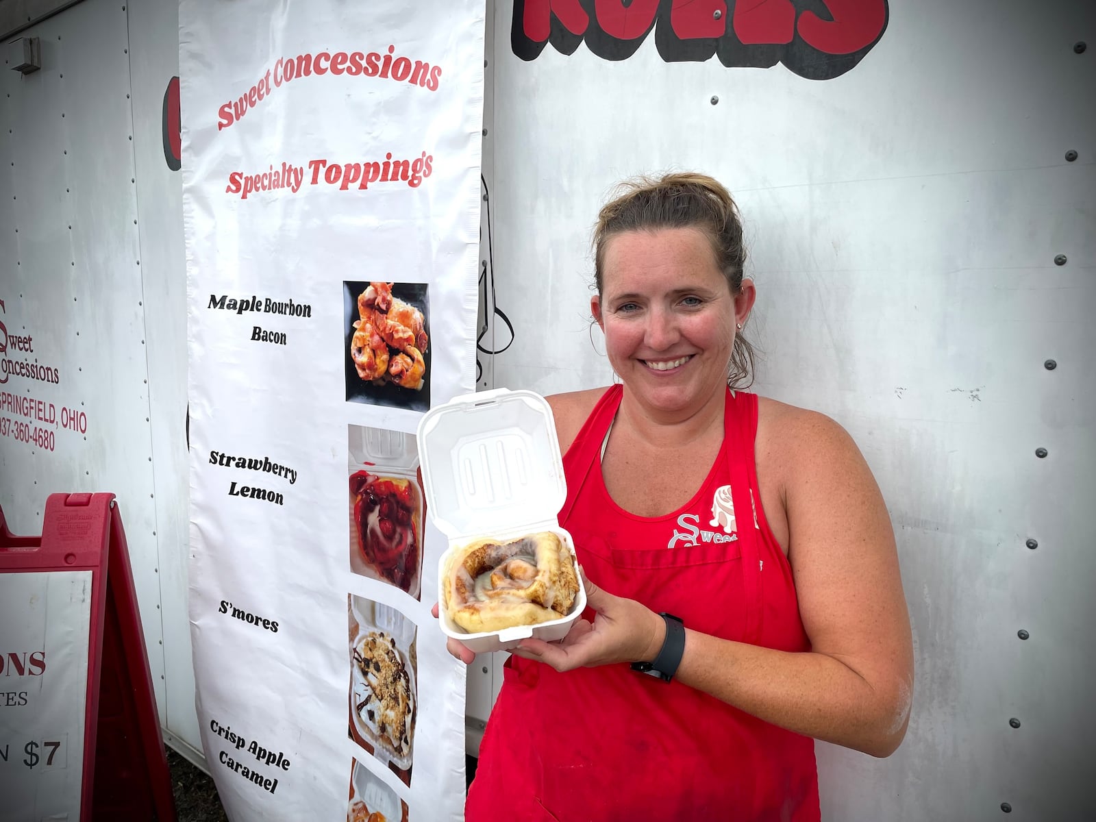 Sweet Concessions offers cinnamon rolls, cinnamon sticks and cinnamon bites at the Clark County Fair. Pictured is Leslie Clarkston, the daughter of the owner. NATALIE JONES/STAFF