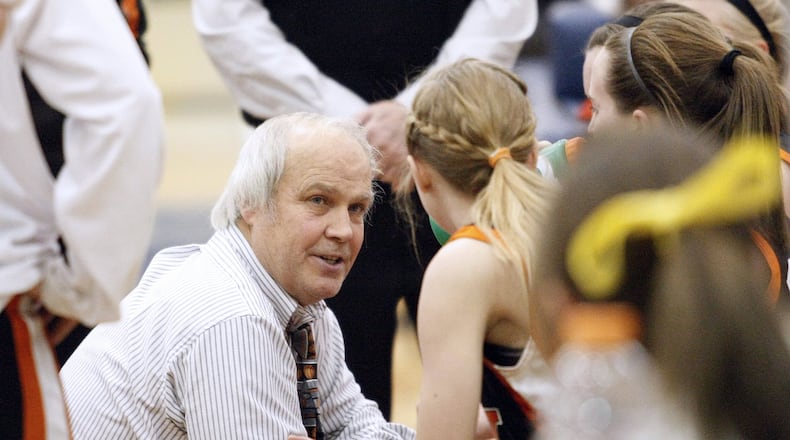 Beavercreek High School girls basketball coach Ed Zink celebrated after a win over Springfield gave him the state’s all-time victory record on Thursday, Feb. 10, 2011. DDN file photo