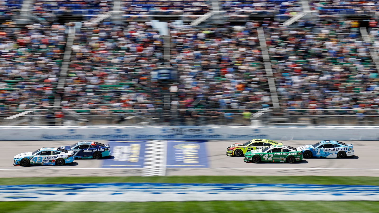 Drivers head down the front straightaway during a NASCAR Cup Series auto race at Kansas Speedway in Kansas City, Kan., Sunday, May 11, 2025. (AP Photo/Colin E. Braley)