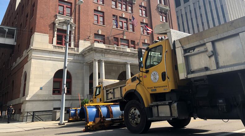 Street maintenance trucks parked outside of Dayton City Hall in 2019. CORNELIUS FROLIK / STAFF