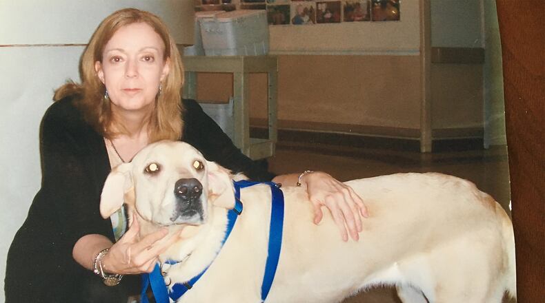 Linda Healy with her yellow Labrador Candy while doing rounds at a local nursing facility in 2007. Candy passed away shortly after her husband Chuck died in late 2014.