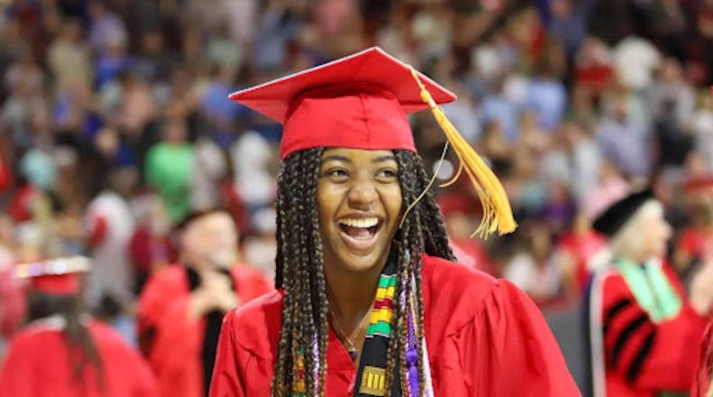 A 2023 Miami University graduate laughs during the Oxford commencement ceremony. MEGAN WATTERSON/MIAMI UNIVERSITY