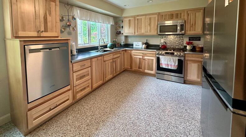 Susan Walters Crowe says the windows (and the yard) drew her to the home she purchased in 2020 with her husband. ROBIN McMACKEN / STAFF