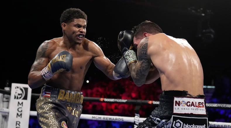 FILE - Shakur Stevenson, left, throws a punch at Oscar Valdez during the WBC-WBO junior lightweight title boxing bout Saturday, April 30, 2022, in Las Vegas. (AP Photo/John Locher, file)