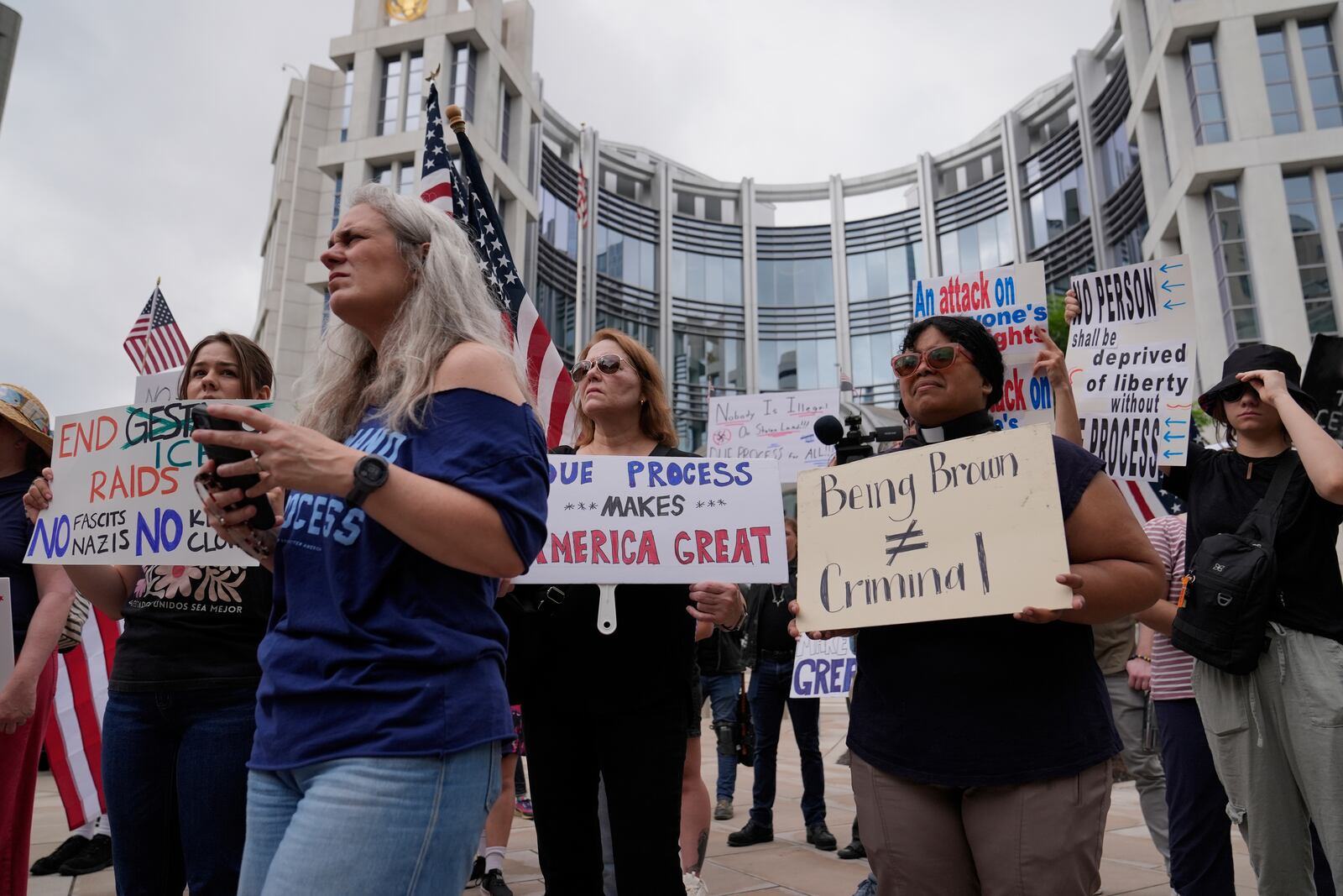 Protesters gather outside the Federal Courthouse before arguments about whether Kilmar Abrego Garcia can be released from jail on Friday, June 13, 2025 in Nashville, Tenn. (AP Photo/George Walker IV)