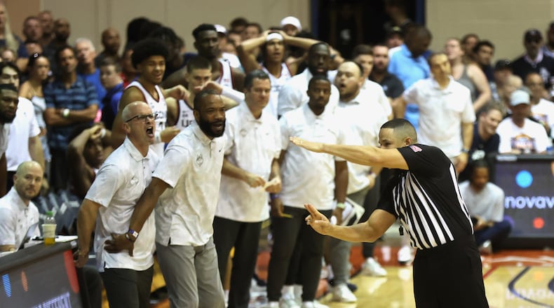 Connecticut's Dan Hurley, left, reacts as an official calls him for a technical foul in overtime against Memphis in the first round of the Maui Invitational on Monday, Nov. 25, 2024, at the Lahaina Civic Center.