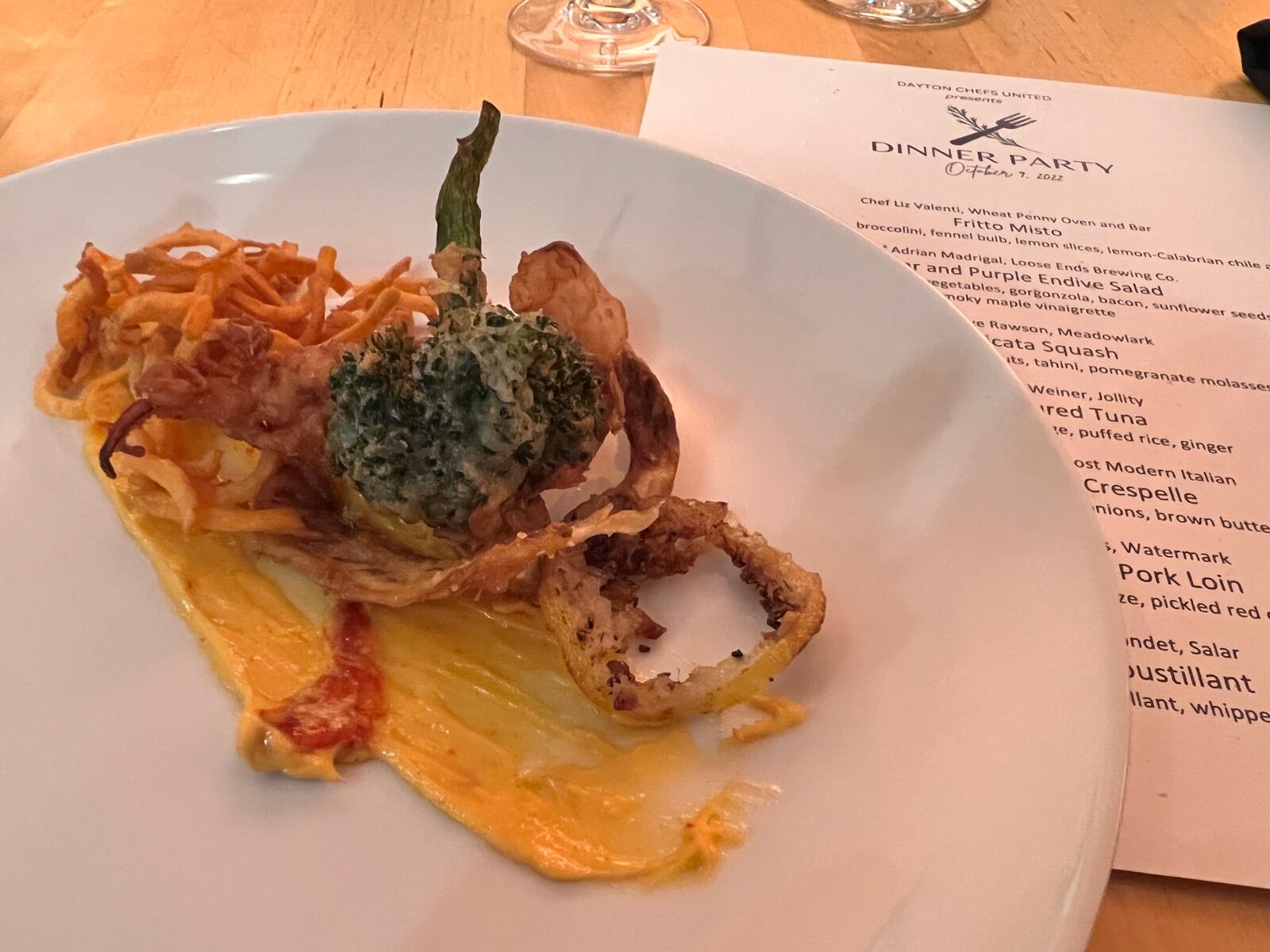 Dayton Chefs United Dinner: Fritto misto, or a "fried mix" in Italy with lightly battered and fried calamari, shrimp, broccolini, fennel and lemon with a lemon-calabrian chile aioli. ALEXIS LARSEN/CONTRIBUTOR