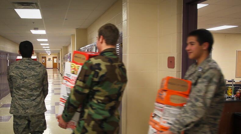 Junior ROTC students work on a food drive at a local school. STAFF FILE PHOTO