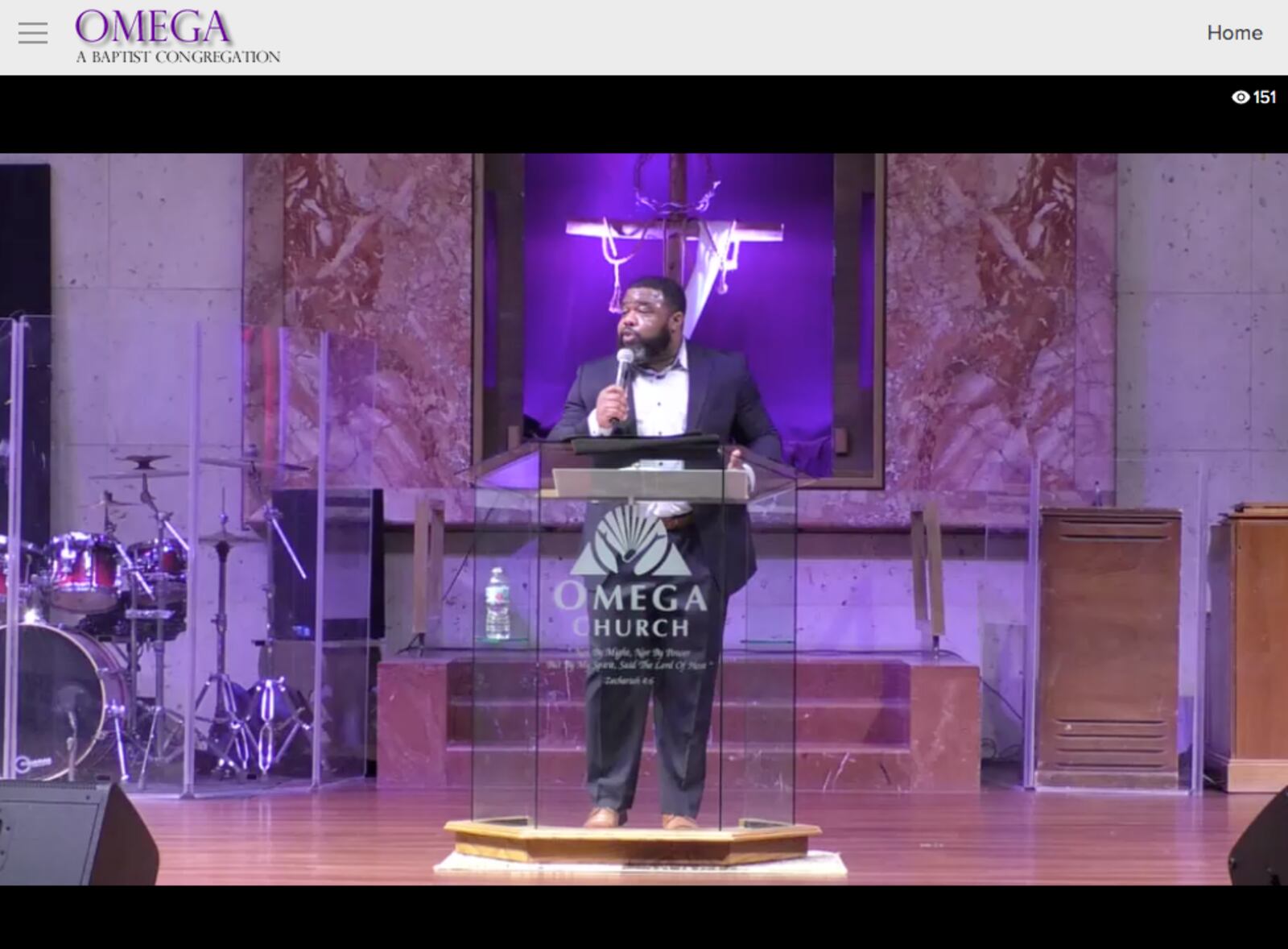 Joshua Ward, pastor of Omega Baptist Church, preaches to his congregation Sunday, Jan. 10.