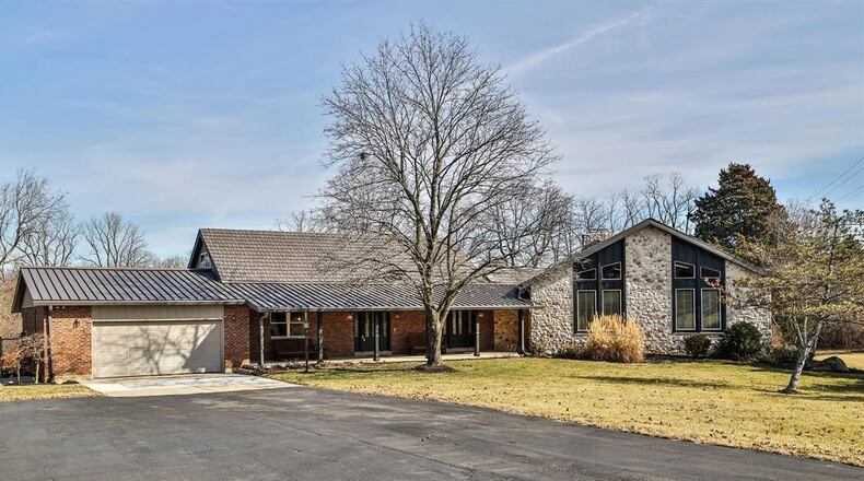 Nearly unlimited living options are under one roof in this multi-level brick and stone home on 9.5 acres in Monroe Twp. CONTRIBUTED PHOTOS