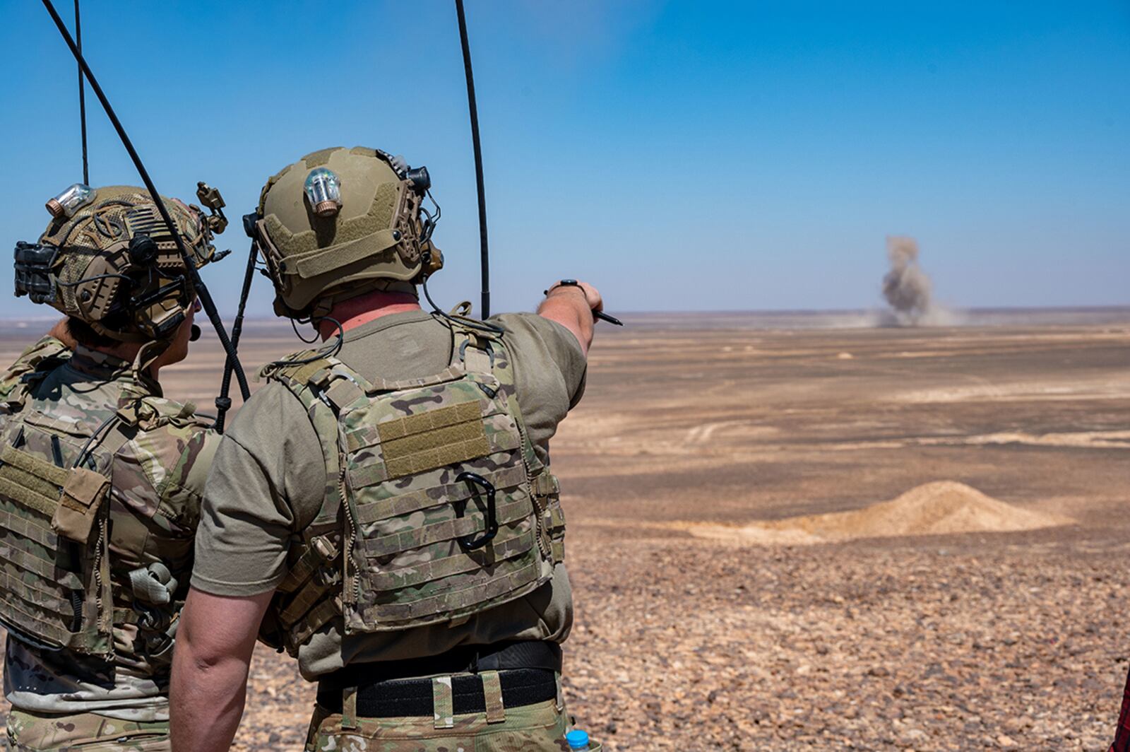 Two Joint Terminal Attack Controllers observe a bomb impact during a routine training exercise with 332nd Air Expeditionary Wing F-15E Strike Eagles at an undisclosed location in southwest Asia on July 7. The F-15E is a dual-role fighter designed to perform air-to-air and air-to-ground missions with an array of avionics and electronics systems that give it the capability to fight at low altitude, day, night and in all weather conditions. U.S. AIR FORCE PHOTO/MASTER SGT. KELLY GOONAN