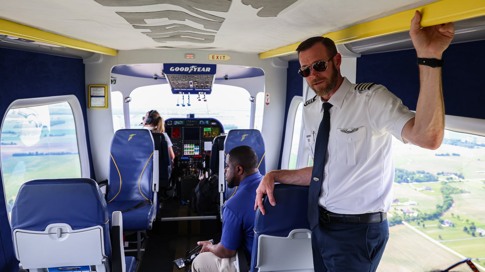 Michael Dougherty, chief pilot and operations manager for Goodyear's airship team, talks to passengers during a flight over Troy on Friday, June 20. The Goodyear Blimp arrived at WACO Air Museum ahead of participating in the Centerpoint Energy Dayton Air Show this weekend. BRYANT BILLING / STAFF