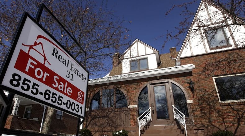 A sign advertises a home for sale along Oak Knoll Dr. in Oakwood. File.