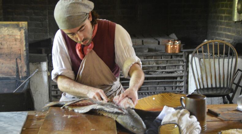 Kitchen staff at the Colonial Williamsburg governor’s palace still prepare food items daily according to period tradition. (Myscha Theriault/TNS)