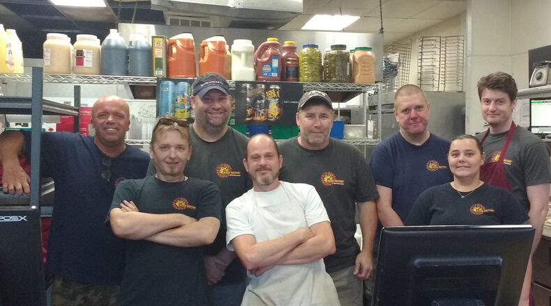 Staff members of Dayton's Original Pizza Factory, including, from left to right: Brian Pilgrim, Rick Pierce, John Sullivan, Justin Barkley, Bill Daniels, Dan Azbill, Angie Elzey, and Daniel Hughes. CONTRIBUTED