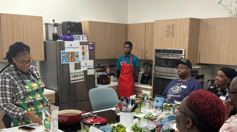 Dr. Judith Davis helps her students learn about healthy eating at the Premier Health YMCA. CONTRIBUTED