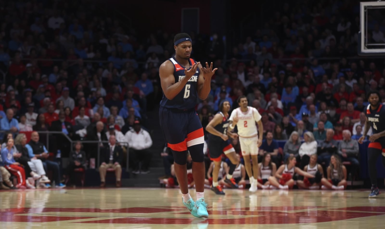 Duquesne's Alex Williams reacts after making a 3-pointer in the first half against Dayton on Saturday, Feb. 21, 2026, at UD Arena. David Jablonski/Staff
