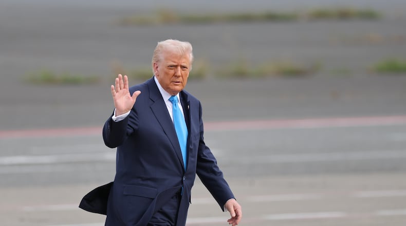 U.S. President Donald Trump walks towards Air Force One at Haneda Airport in Tokyo for his departure to South Korea, Wednesday, Oct. 29, 2025. (Kim Kyung-Hoon/Pool Photo via AP)