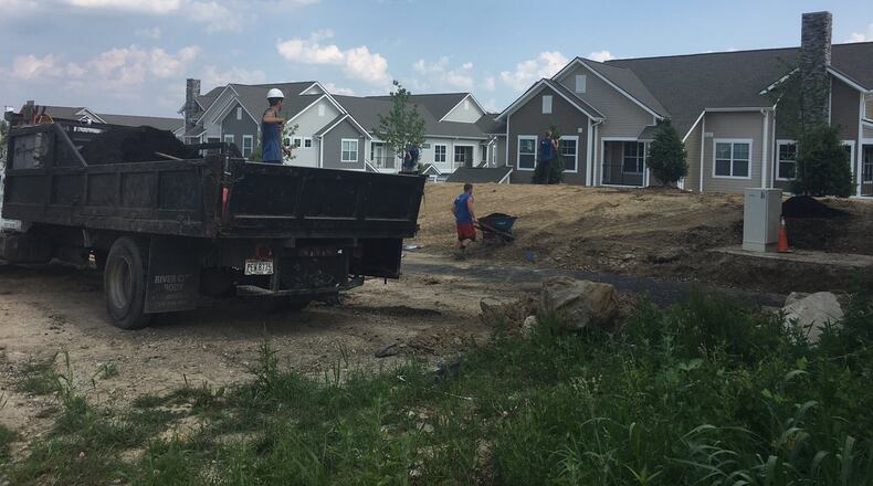 Construction continues on the Waterford of Sugarcreek luxury apartments community on Feedwire Road. Developers in Greene County will pay additional fees on projects if extensions are needed or decisions must be delayed by the Greene County Regional Planning and Coordinating Commission. RICHARD WILSON/STAFF