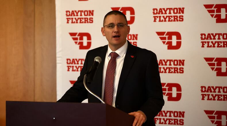 Neil Sullivan introduces Trevor Andrews as Dayton head football coach on Wednesday, Dec. 14, 2022, at UD Arena. David Jablonski/Staff