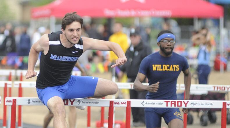 Miamisburg senior Colin Dillon (left), shown at the recent GWOC meet, won the 110-meter high hurdles and 300 hurdles in the D-I district at Bellbrook. MARC PENDLETON / STAFF