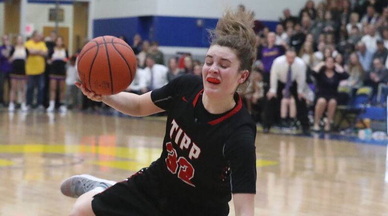 Tipp’s Maddie Frederick draws a foul from Bellbrook’s Cassidy Hofacker. Bill Lackey/Staff