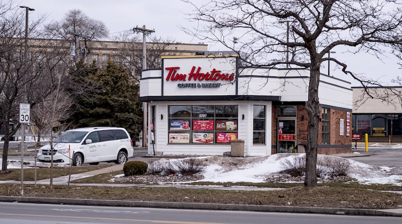 A vehicle rests in the parking lot of a Tim Horton's Coffee and Bakery shop, Friday, Feb. 27, 2026, in Buffalo, N.Y., the site where Nurul Amin Shah Alam, was dropped off after being released by Border Patrol agents last week. (AP Photo/Craig Ruttle)