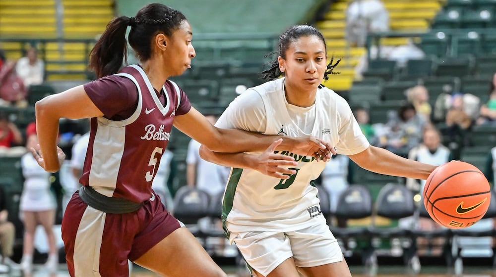 Wright State senior guard Breezie Williams dribbles with pressure from Bellarmine's Ashlee Harris during a nonconference game on Wednesday, Nov. 19 at the Nutter Center. Williams led the team with 18 points and had five rebounds and four assists. BRYANT BILLING/STAFF
