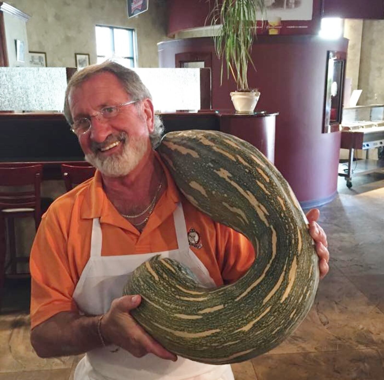 Franco Germano holding a squash — a very large squash — in the restaurant he founded in 1976 at the age of 31: Franco’s Ristorante Italiano, at 824 E. Fifth St. in Dayton. SUBMITTED