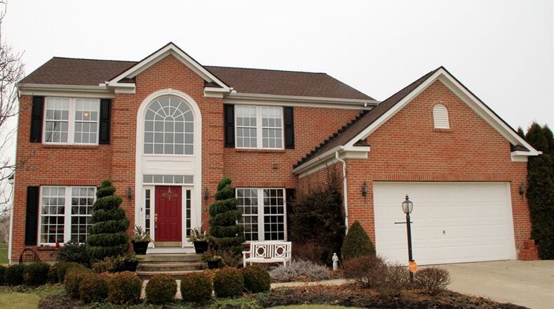 The brick-and-frame home has about 4,500 sq. ft. of living space. The house sits on a half-acre lot with a pergola that covers part of the deck. The 4-bedroom home includes a finished basement CONTRIBUTED PHOTOS BY KATHY TYLER