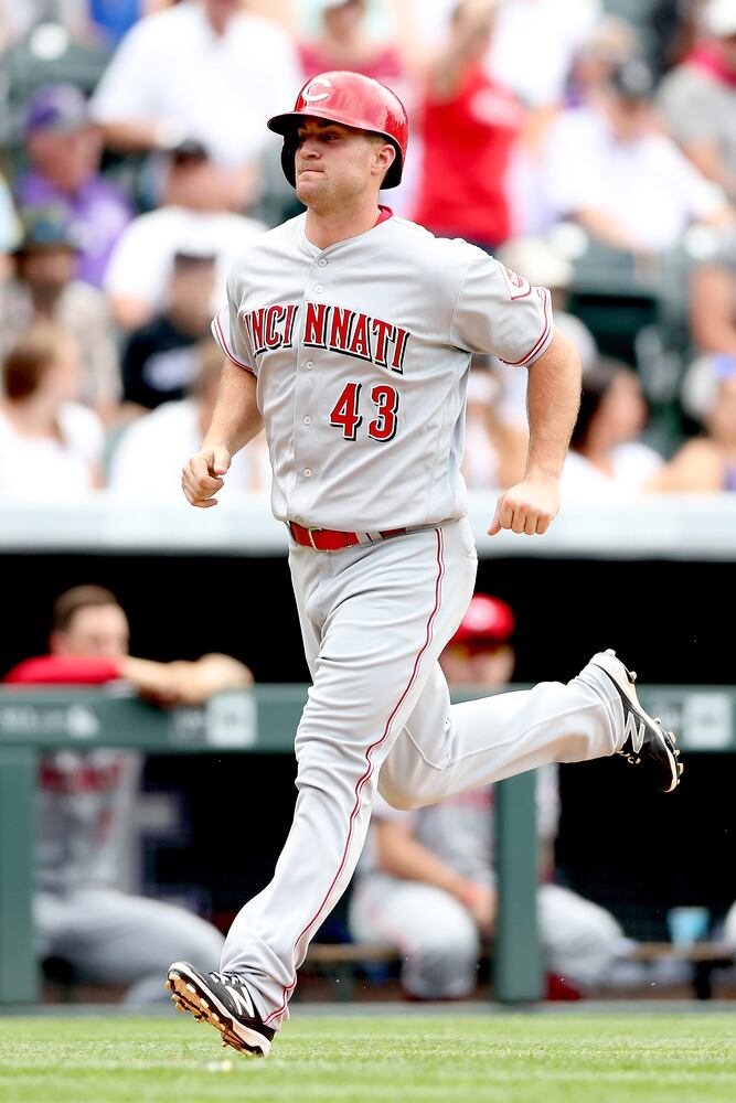 PHOTOS: Reds pile up 13 hits, beat the Rockies