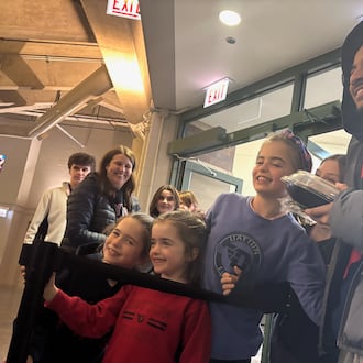 Dayton's Javon Bennett poses for a photo with fans after a victory against Loyola Chicago on Saturday, Jan. 3, 2026, at Gentile Arena. David Jablonski/Staff