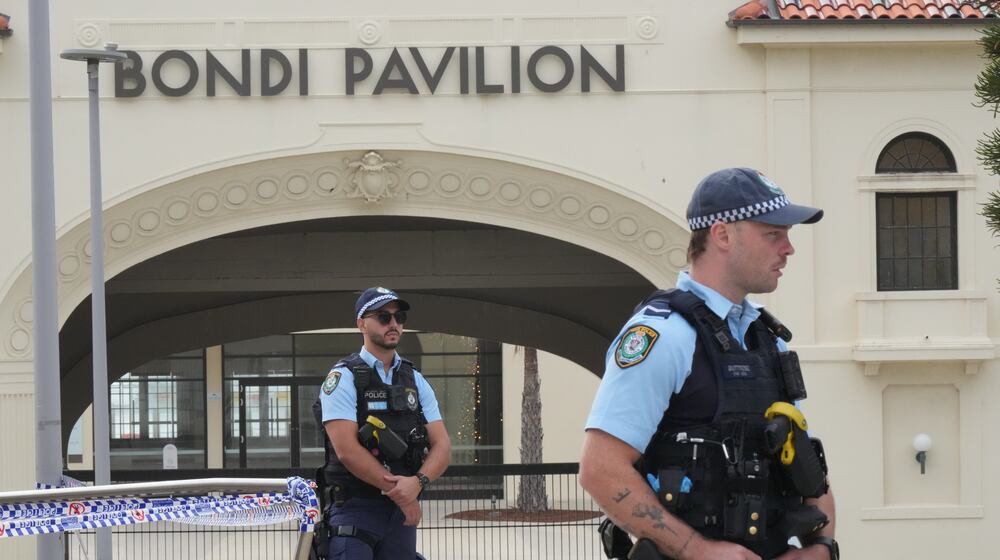Police patrol in the early morning following a shooting Sunday at Sydney's Bondi Beach, Monday, Dec. 15, 2025. (AP Photo/Mark Baker)