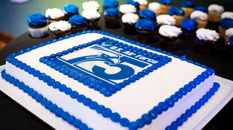 Col. Kim Bowen, 88th Air Base Wing chaplain, and Airman 1st Class Hannah Flamm, an 88th Security Forces Squadron Defender, cut the cake Sept. 16 in celebration of the Air Force’s 75th birthday at Wright-Patterson Air Force Base. U.S. AIR FORCE PHOTO/HANNAH CARRANZA