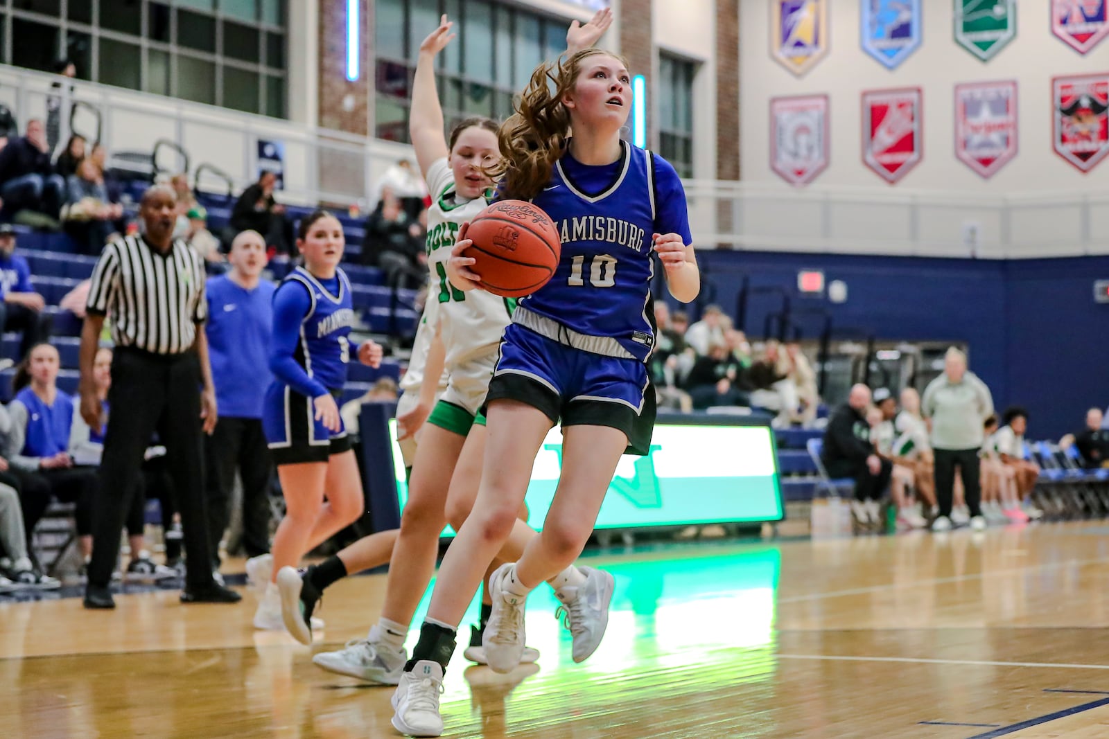 Miamiburg's Madalyn Ball drives past a Northmont defender during their Division I tournament game earlier this year at Fairborn High School. MICHAEL COOPER / CONTRIBUTED PHOTO