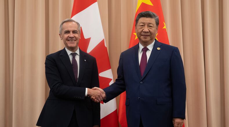 Canadian Prime Minister Mark Carney, left, shakes hands with Chinese President Xi Jinping at the start of a meeting in Gyeongju, South Korea, Friday, Oct. 31, 2025. (Adrian Wyld/The Canadian Press via AP)