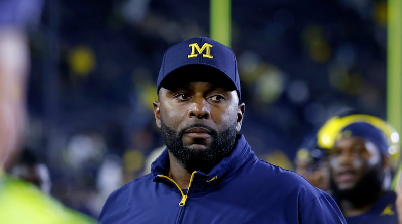 FILE - Michigan coach Sherrone Moore walks off the field following an NCAA football game Aug. 30, 2025, in Ann Arbor, Mich. (AP Photo/Al Goldis, File)