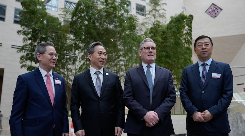 From left, Zheng Zeguang, Chinese ambassador to to Britain, Ren Hongbin, Chairman of the China Council for the Promotion of International Trade (CCPIT), Britain's Prime Minister Keir Starmer and Ge Haijiao, Chairman and Executive Director of the Bank of China Limited (BOC) pose for photos in Beijing, China, Friday, Jan. 30, 2026. (AP Photo/Kin Cheung, Pool)